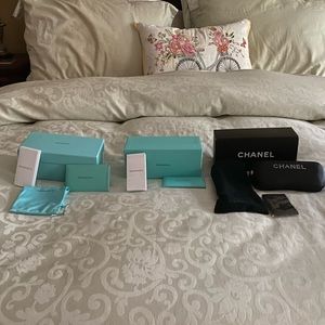 Lot of 2 Tiffany sunglass boxes and one Chanel sunglass box.